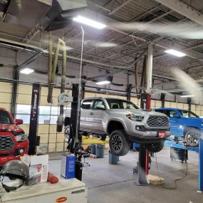 Image of the service area and inside truck lifts at Trucks Plus in Omaha Nebraska