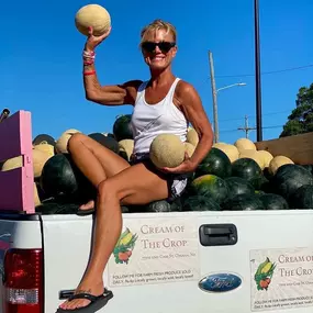 Engaging with the community and handing out delicious melons!