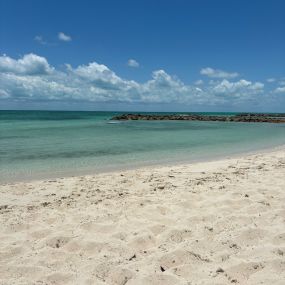 Happy National Beach Day!  Take some time today to think about the sun, sand, and surf that bring us so much joy and peace. What is your favorite beach memory? #NationalBeachDay #SunAndSand #BeachMemories