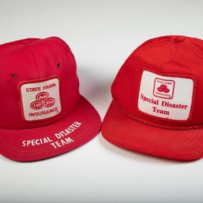 These hats were first worn in 1971 by members of the Special Disaster Team. In the spirit of being a good neighbor, [tag] State Farm employees volunteered for these teams and traveled to the scenes of natural disasters to help customers recover quicker.