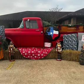 The little red truck has made his way to the office. We would love for you to stop by and take some pictures!  We will have it set up daily during the week as long as the weather permits until Christmas. Check out the silly photo some of our staff enjoyed taking this morning!