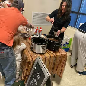 We volunteered at one of our local elementary schools (Forest Acres Elementary). We provided a free hot cocoa bar for the parents and children at their Winterfest Family Night. So fun!