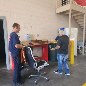 Steven Gillis State Farm Insurance agent dropping off fire prevention month gift boxes and info packets to local fire dept