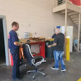 Steven Gillis State Farm Insurance agent dropping off fire prevention month gift boxes and info packets to local fire dept