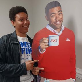 We love it when people stop in and pose with Jake... Feel free to swing by the office any time to take some yourself!