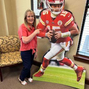 Our office manager, Mary Crabb, just celebrated her 48th year with State Farm and the Mader Bagley family! She started as a student at WHS in a work study program when Kim’s Dad was the agent. We are so proud of her and so grateful to have her leadership all these years. Truly, she’s one in a million!
When Mary isn’t at at work she loves being with her grandkids and watching football. Here she is with her #1 player!