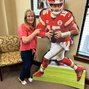 Our office manager, Mary Crabb, just celebrated her 48th year with State Farm and the Mader Bagley family! She started as a student at WHS in a work study program when Kim’s Dad was the agent. We are so proud of her and so grateful to have her leadership all these years. Truly, she’s one in a million!
When Mary isn’t at at work she loves being with her grandkids and watching football. Here she is with her #1 player!