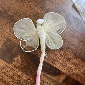 This butterfly has been with me for almost 20 years in my pen cup. It has faded and is faded but I love it. My daughter, Brooke made it in elementary school.  What have you kept on your desk for years?