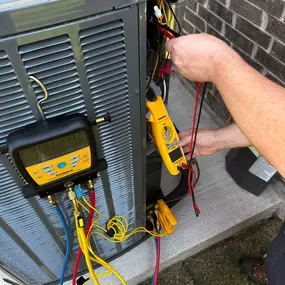 Climate control employee installing new system outside