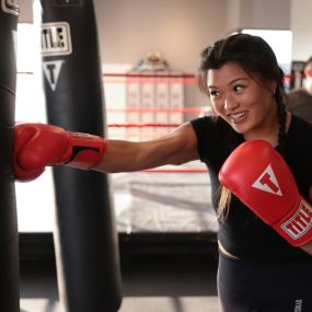 Woman training at a TITLE Boxing Club Gym
