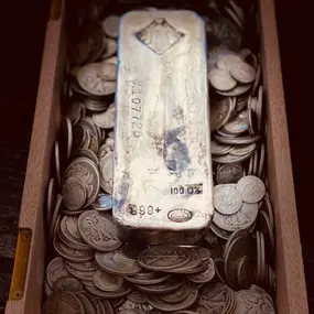 100 oz JM Silver Bar on a lot of 90% Junk coinage.