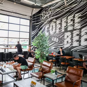 As the sun sets, Sip transforms into a lively cocktail lounge. The space takes on a more vibrant brewery vibe, attracting a fun-loving crowd looking to unwind.
