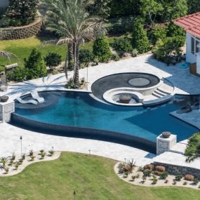 Stunning New Modern Inground Pool, tanning ledge, fire pit, and landscaping