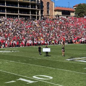 Celebrating a successful 25-yard field goal as part of the Allstate “Good Hand” Field Goal Net Program.  The kicker won $1000 and the University of Colorado scholarship fund received a matching donation.