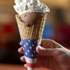 Chocolate Frozen Custard with Whipped Cream in Waffle Cone