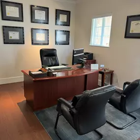 Attorney Chad Pajerski’s office with professional certifications displayed.