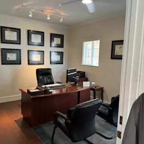 Attorney Chad Pajerski’s office with professional certifications displayed.