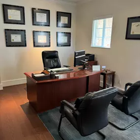 Attorney Chad Pajerski’s office with professional certifications displayed.