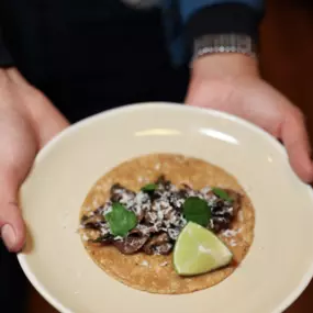 Champiñones (Mushroom) taco with a lime slice.