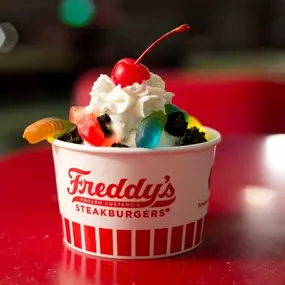 Cup of Frozen Custard with Gummy Worms, Whipped Cream, and Cherry on top