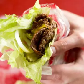 Burger in Lettuce Wrap with Onion and Pickles