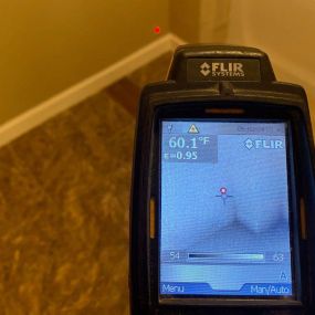 As you can see in this picture, our FLIR thermal imaging camera is detecting moisture behind the wall and under the carpet in this Siren Wisconsin basement.