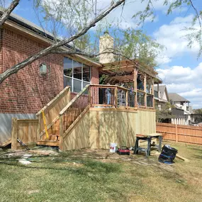 Deck renovation, including structural reinforcement, re-decking, staining, and new staircase