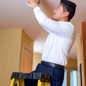 Electrical Installation of New Recessed Lighting In Ceiling Of Residential Home