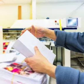 Employee works through stack of files