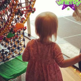 Isn’t this the best... ???? Gramma’s girl taking a long hard look at the K’Nex Ferris Wheel her Grampa built for the store window! ????????