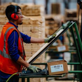 Rose Pallet Employee with Machinery