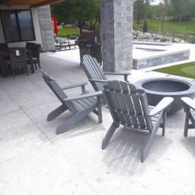 We delivered this woven dining set, Adirondack chairs, chaise lounges, and 2 grills to this beautiful backyard in Erie!