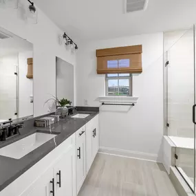 Elegant owners bath with dual vanity.