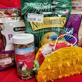 Get ready for Taco Tuesday!!! Stop in at our store for your bird's Fiesta needs! Check out our bird piñata section with Llamas, tacos, saguaros, pineapples, and more! These super fun interactive piñatas come pre-filled with confetti. For extra fun, you can stuff in some of your bird's favorite treats! Trucker, our store's African Gray, can't get enough of her taco piñata filled with all her favorite treats!!