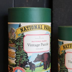 Featuring illustrations of iconic national parks like the Grand Canyon and Yosemite, this premium quality puzzle has a vintage print finish that highlights the timeless appeal of the great outdoors.