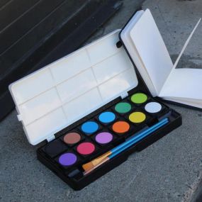 Set contains 12 opaque watercolor paints!

Dry gouache colors are vibrant and opaque -- perfect for painters of all experience levels.
12 watercolor cakes in a versatile palette.
Bright, dense pigment layers well over a pencil sketch.
2 brushes included: round detail brush and flat shader.
Lid doubles as a built-in palette, with 9 partitioned compartments for easy mixing.
Individual paint pans snap into and out of box, making it easy to reorganize or clean the set.
Opaque dry gouache watercolors