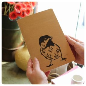 An adorable little chickadee on a notebook!

Hand printed by @brianleefritz this A5 size notebook has a kraft paper cover and 60 unlined pages inside. Perfect gift for the bird lover in your life!