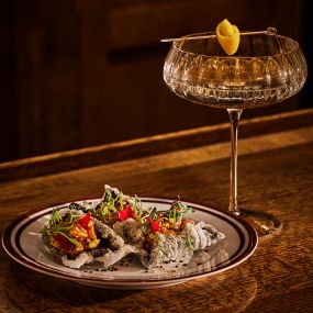 Cocktail and appetizers served at the bar.