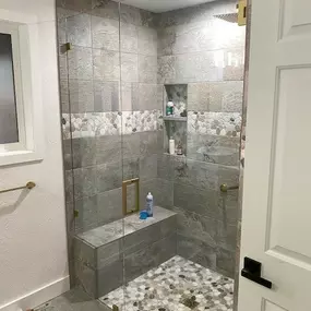 Shower door with soft brass hardware