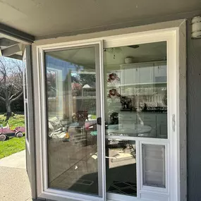 Vinyl patio door with pet panel installed