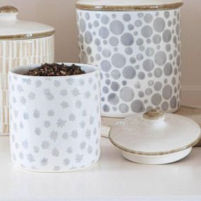 Our new ceramic canisters feature subtle hand-painted patterns in beautiful earth flower and polka dot designs.