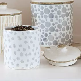 Our new ceramic canisters feature subtle hand-painted patterns in beautiful earth flower and polka dot designs.