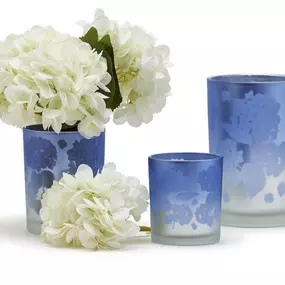 Indulge in the intricacy of design with two sizes - Votive and Hurricane - for creating delightful arrangements that emit a cozy and inviting radiance in any space. Crafted from high-quality glass, these candleholders not only exhibit stunning hydrangea patterns, but also promise durability for lasting satisfaction.