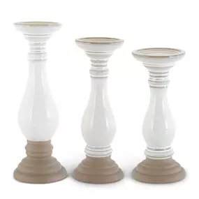 Bring a unique elegance to any room with our ceramic candleholders, featuring unglazed bases that add a touch of rustic charm. These beautifully crafted candleholders come in three varying sizes, perfect for creating a cozy ambiance in any space. ????️✨