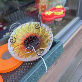 This is something I have observed over the last few years. My Orioles leave nesting material in the jelly!! In one of my other feeders, I keep finding horse hair and in this feeder they left a piece of string/fabric!! Quirky birds they are!!