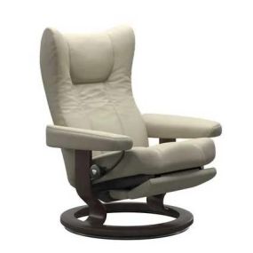 Stressless recliners with Power Leg & Back have a motorized reclining function in the backrest and the integrated footrest. To operate, use the set of buttons that are discretely placed under the armrest. There is a battery option that comes with a magnetic charger attachment for easy access.