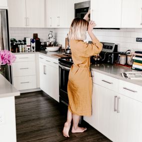 Woman enjoying her newly updated kitchen