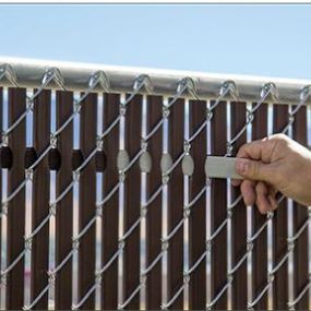 Contractor working on fence slats