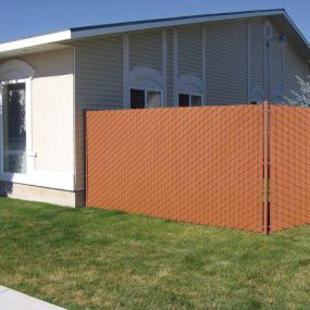 Chain link fence privacy slats in front yard of home