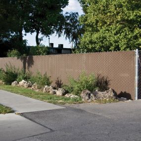 Chain link fence privacy slats in front yard of home